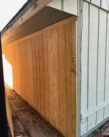 New unpainted wood siding next to existing painted siding