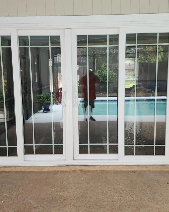 Installed sliding glass doors facing a pool